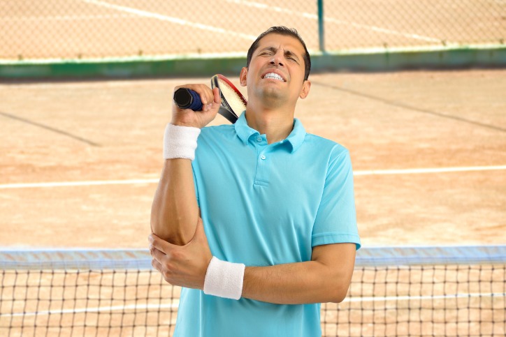 injured-tennis-sportsman-picture-id817521334 tennis elbow treatment houston